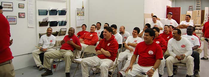 Group of men sitting in the room and laughing