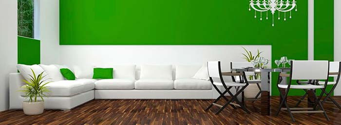 Interior of a room with white sofa and green wall