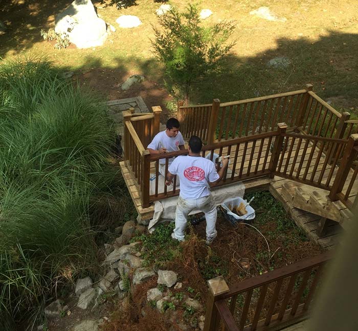 Two men working in backyard