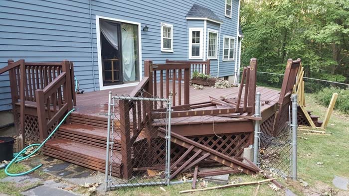 Damaged deck in front of the house
