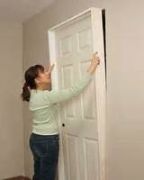 A girl fixing the door